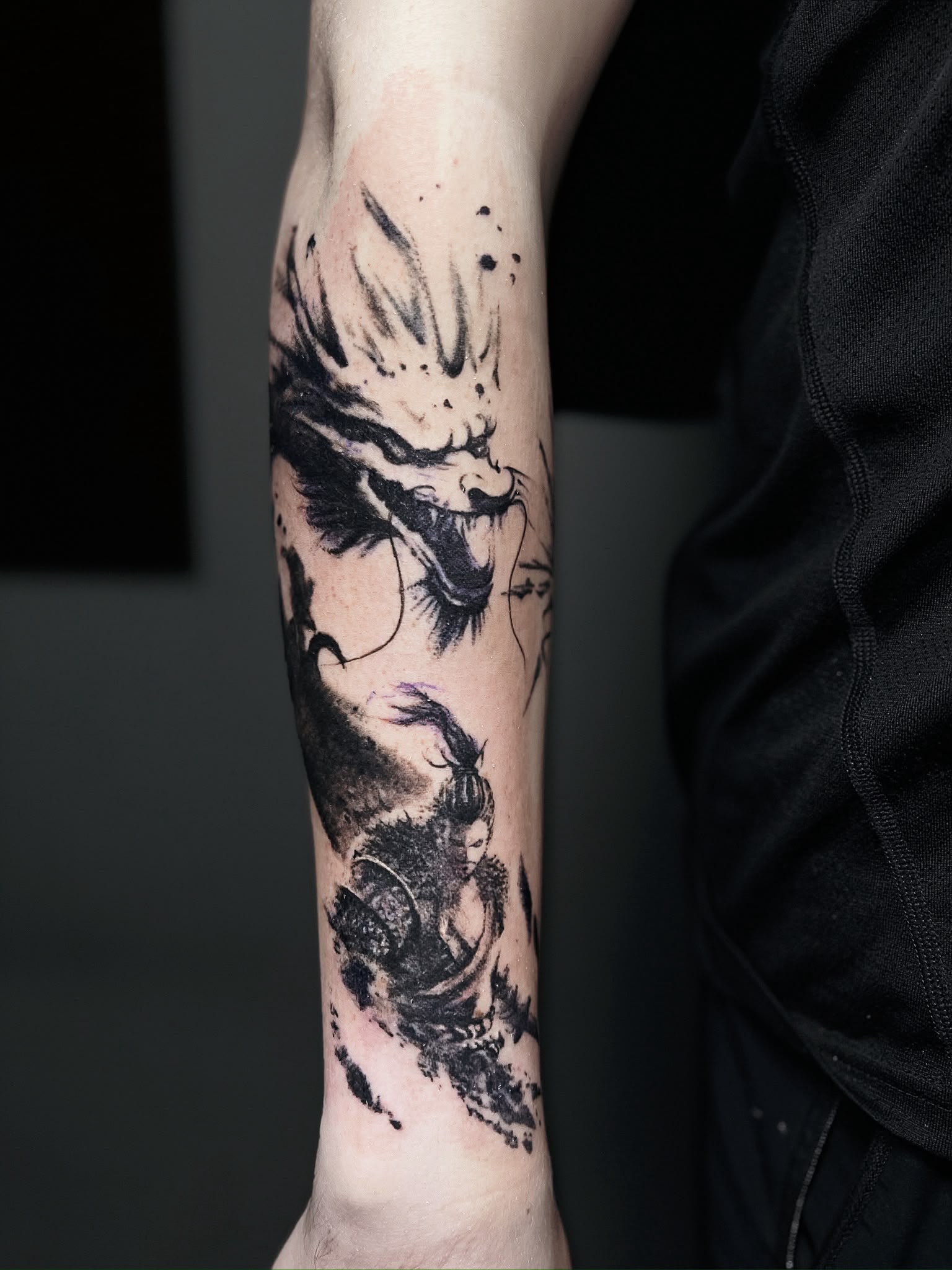 black and grey ink wash dragon tattoo